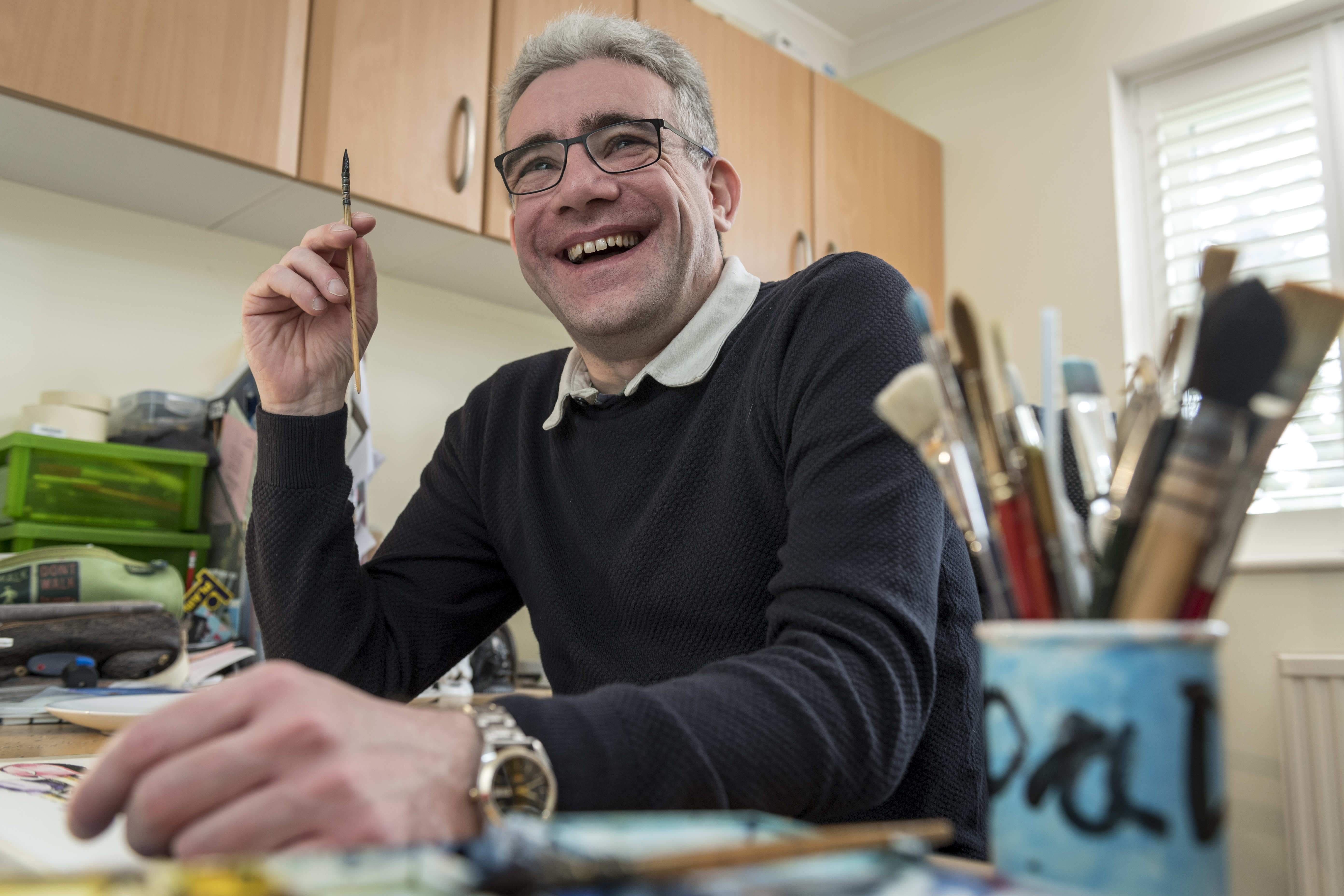 Martin Rolfe head shot image with paint brushes