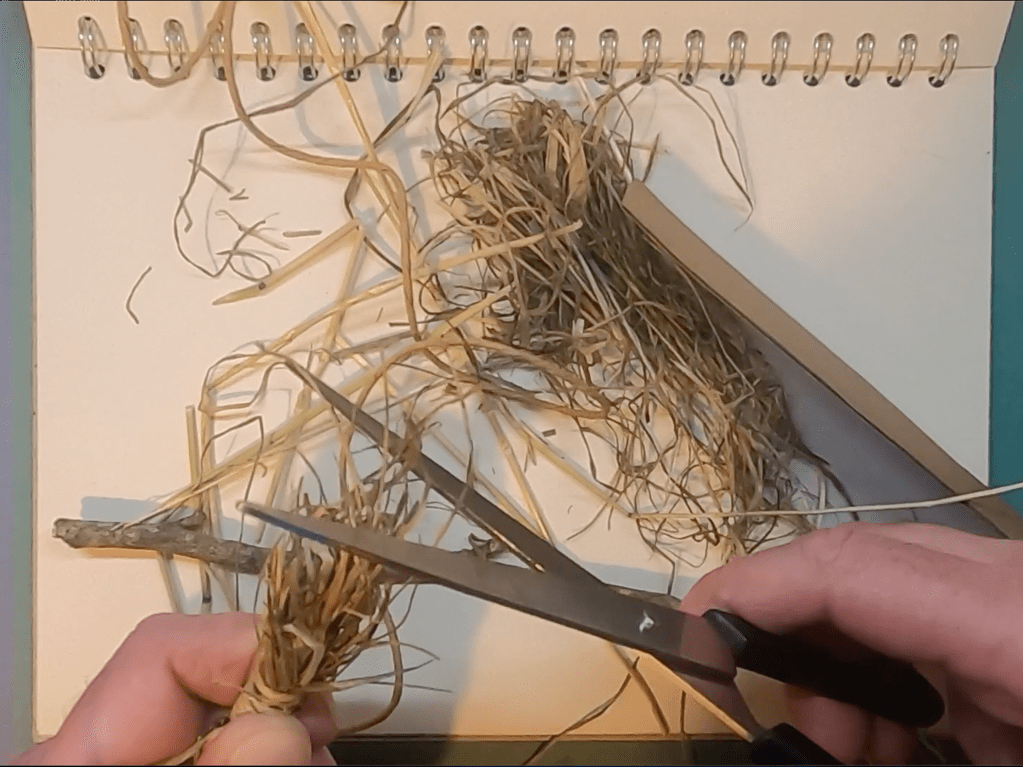 Trimming hay brush with scissors image