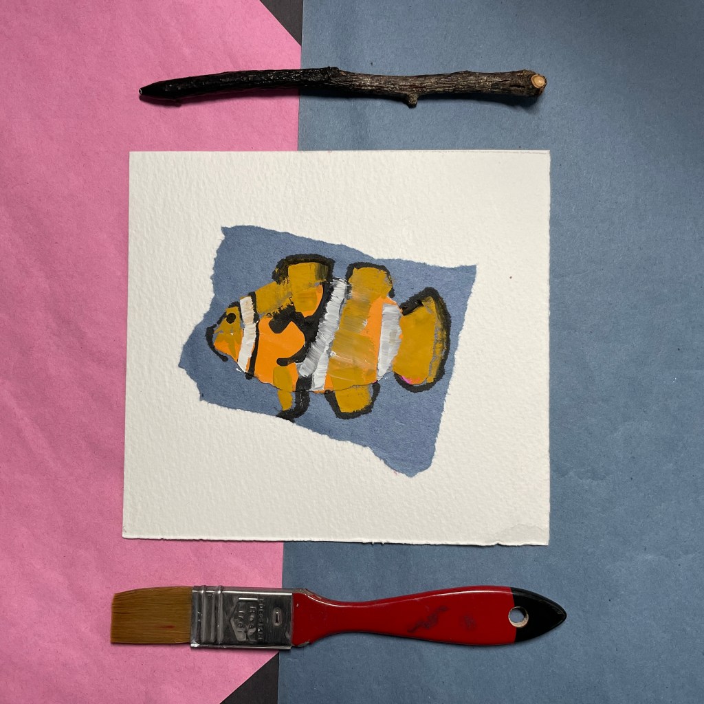 Collage clown fish image with ink stick and watercolour brush. 